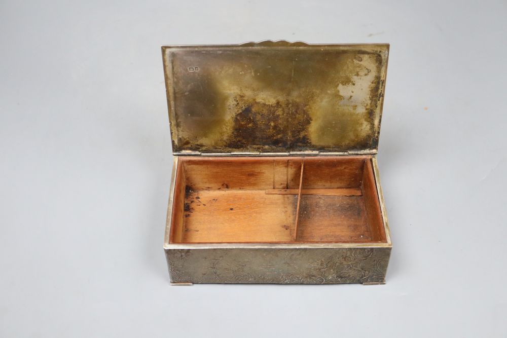 A 1970s silver rectangular cigarette box, by S.J Rose & Son, with samorodok decoration, 18.4cm, gross 28.5 oz.